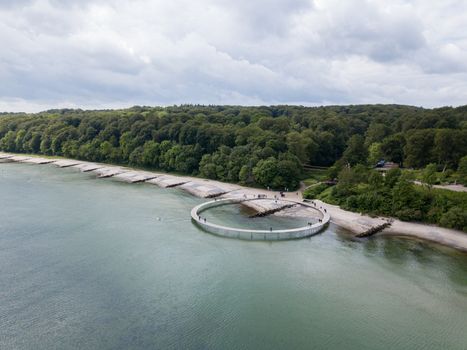 Aarhus, Denmark - June 9, 2019: Aerial drone view of the Infinity Bridge, a work of art by architect Niels Povlsgaard and Johan Gjoedes.