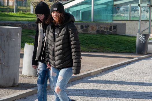 11/20/2020. Prague, Czech Republic. People during quarantine period due to coronavirus at Hradcanska metro stop in Prague. Girlfriends are walking.