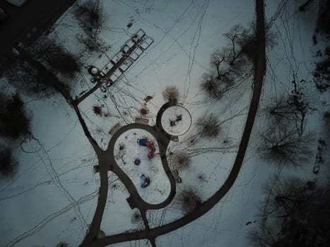 aerial view of a winter park with lots of trails and a playground. High quality photo