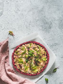 beetroot pizza crust with fresh swiss chard or mangold beetroot leaves.Ideas and recipes for healthy vegan snack.Egg-free pizza crust with chia seed and wholegrain brown rice flour.Copy space.Top view