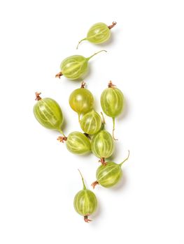 Ripe green gooseberry berries on white background. Creative layout made of organic gooseberries. Isolated on white with clipping path. Top view or flat lay. Copy space for text. Food concept. Vertical
