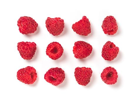 View from above of ripe red raspberry on white background. Organic raspberries creative layout pattern, isolated on white with clipping path. Top view or flat lay. Vegan food concept