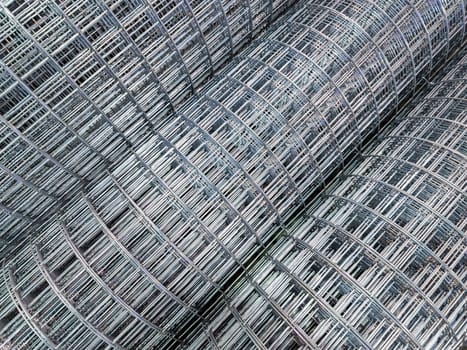 zync plated wired square mesh rolls close-up full frame background with selective focus