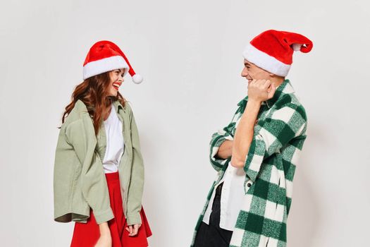 woman standing next to christmas hats communication new year holiday relationship. High quality photo