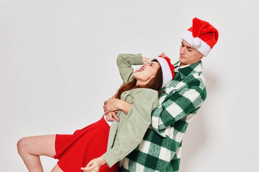 emotional drunk woman next to a man christmas holiday fun Studio. High quality photo