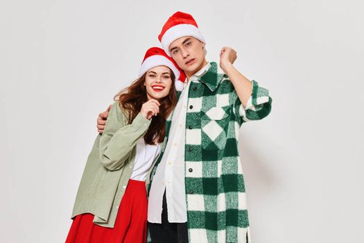 Man and woman hugging New Year's clothes Christmas holiday winter. High quality photo