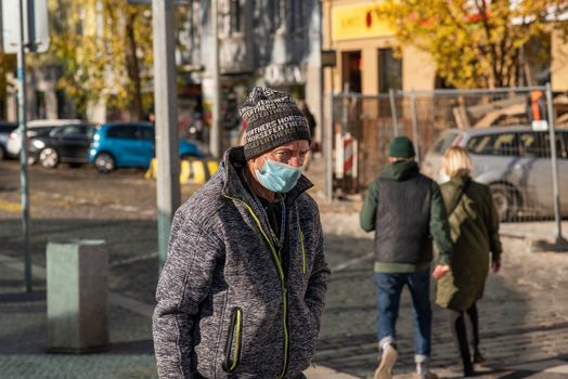 11-22-2020. Prague, Czech Republic. People during quarantine period due to coronavirus (COVID-19) at Hradcanska metro stop in Prague 6. Homeless