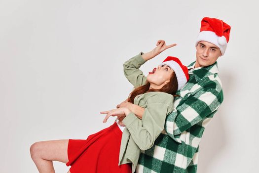 young couple in new year clothes holiday studio emotions fun. High quality photo