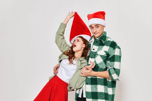 Cheerful drunk woman in the hands of a man emotions New year holiday unity. High quality photo