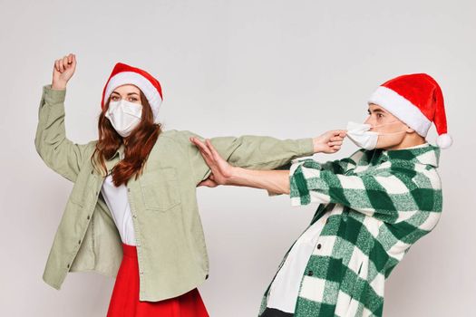 Family couple wearing medical masks New Years winter emotions. High quality photo