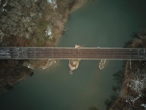 train tracks crossing a river. perfect symmetry. High quality photo