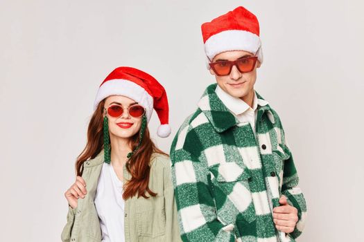 Man and woman are standing next to New Years fun winter holiday Christmas. High quality photo