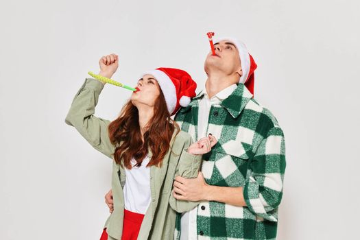man and woman looking up holiday christmas fashion studio fun. High quality photo