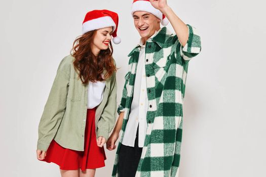 young couple wearing new year clothes fashion holiday studio together. High quality photo