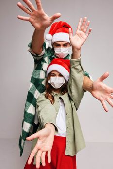 Man and woman in medical masks Christmas holiday New Year friendship. High quality photo