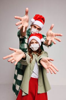 Cheerful medical masked Christmas hats holiday fun New Year. High quality photo