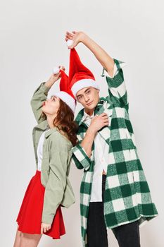 man and woman in new year clothes holiday christmas light background . High quality photo