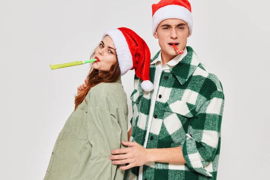 Man and woman Christmas holiday gifts family fun studio. High quality photo