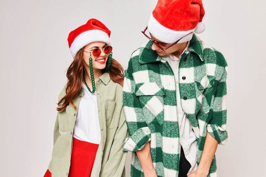 young couple in new year clothes sunglasses fun holiday. High quality photo