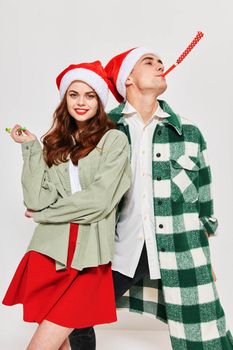 Young couple festive pipe Merry Christmas Fun Together Studio. High quality photo