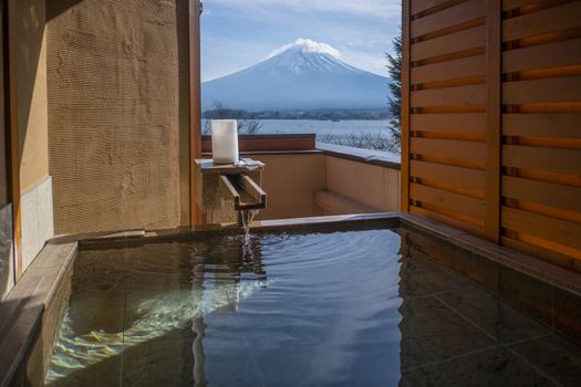 Outdoor hot-spring bath with the beautiful view of Mountain Fuji and Lake Kawaguchiko in Japan