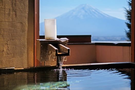 Outdoor hot-spring bath with the beautiful view of Mountain Fuji and Lake Kawaguchiko in Japan