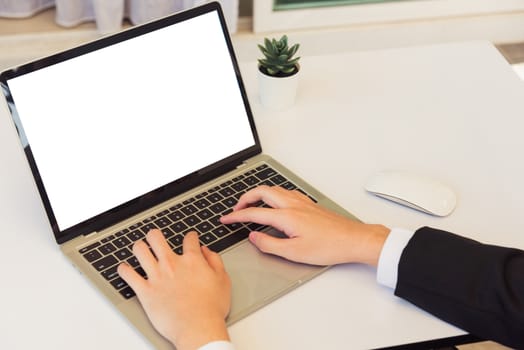 Work from home, Asian young businessman smile wearing suit video conference call or facetime by laptop computer sitting and listening to teammates explained on desk at home office