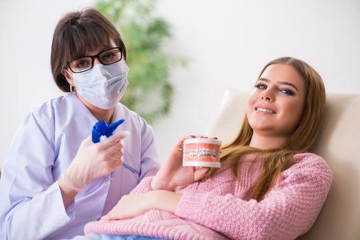 Young woman patient visiting dentist