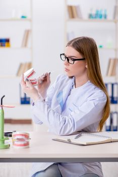 Dentistry student practicing skills in classroom