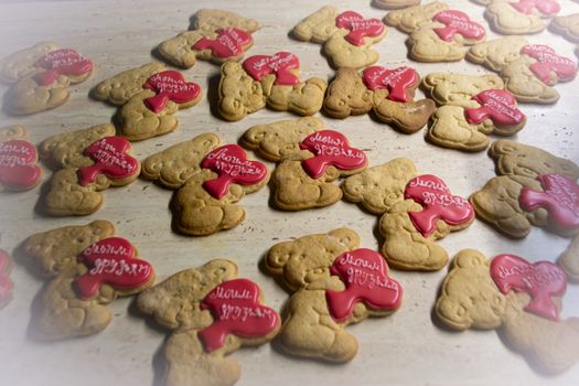 many Teddy bear cookies, decorated with red hearts
