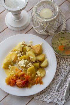 Salad of peper with potato, red onion and herbs served on plate, fish aspic. Flat lay