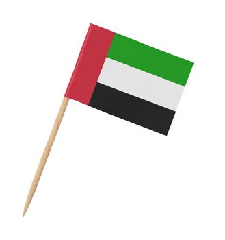 Small paper UAE flag on wooden stick, isolated on white