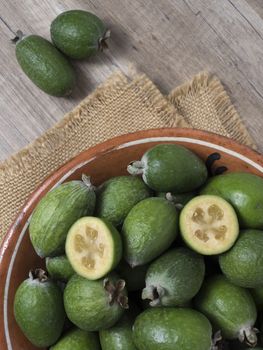 Set tropical fruit feijoa whole and cut in half.
