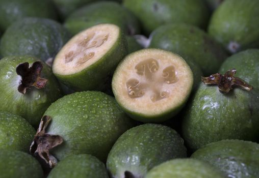 Fresh ripe sweet feijoa fruits. Healthy food background.