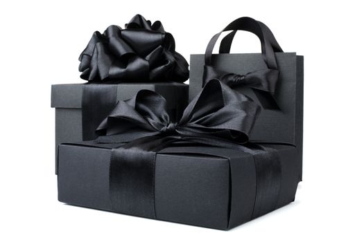 Concept sales, shopping, black friday. Paper shopping or gift bag box with silk ribbon bow isolated on white background