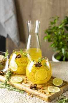 Homemade fruit tea with sea buckthorn, lime, rosemary, star anise and chia seeds for autumn and winter holidays - festive Christmas, Thanksgiving drinks. Healthy food life.