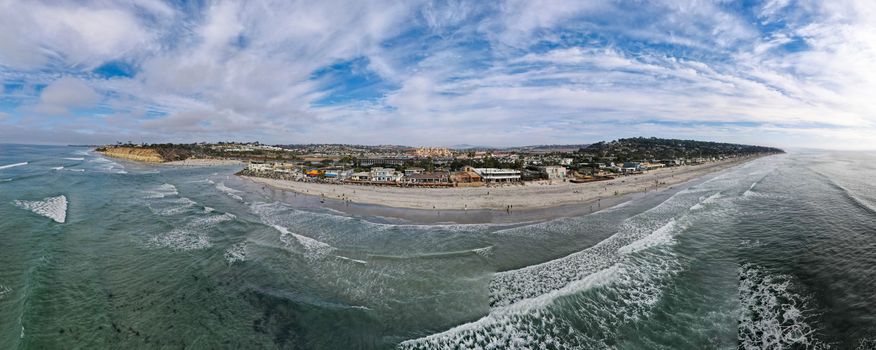 Aerial view of Del Mar coastline and beach, San Diego County, California, USA. Pacific ocean with long beach and small wave. travel destination