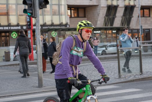 11-23-2020. Prague, Czech Republic. People walking and talking outside during coronavirus (COVID-19) at Hradcanska metro stop in Prague 6. Man in bike.