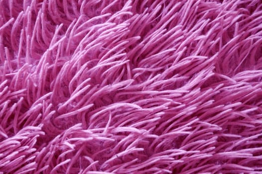 faux pink fur close up, vertical texture for background