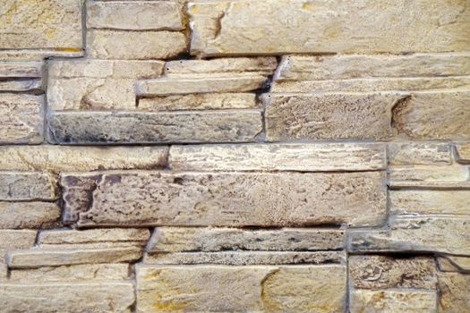 wall trimmed with beige natural stone texture for background.