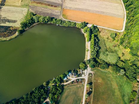 Aerial Drone View Above Large Lake near Wheat Agricultural Fields.