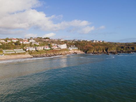 Looking Into Langland Bay in Gower, Wales, UK from the sea on a clean late Autumn day. Blue skies with some clouds