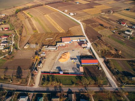 Around the Warehouse Large Agricultural Fields. Aerial View Over The Grain Warehouse.