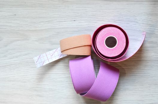 Kinesiological tape rolls. Anti-pain taping for athletes for weight loss, anti-wrinkle.