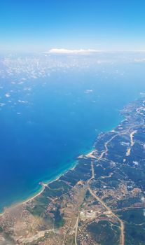 The view from the airplane window to the ground. Landscape view from the sky.