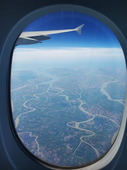 The view from the airplane window to the ground. Landscape view from the sky.