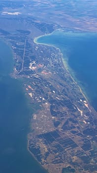 The view from the airplane window to the ground. Landscape view from the sky.