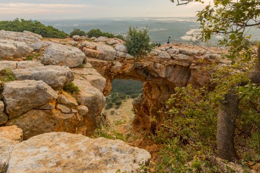 Sunset view of the Keshet Cave, a limestone archway spanning the remains of a shallow cave, in Adamit Park, Western Galilee, Northern Israel