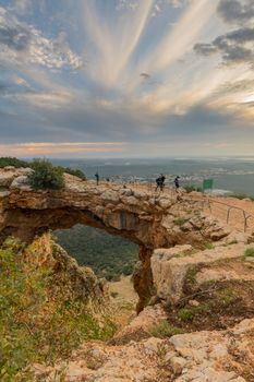 Sunset view of the Keshet Cave, a limestone archway spanning the remains of a shallow cave, in Adamit Park, Western Galilee, Northern Israel