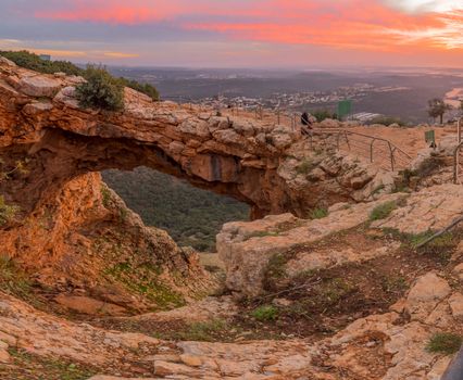 Sunset view of the Keshet Cave, a limestone archway spanning the remains of a shallow cave, in Adamit Park, Western Galilee, Northern Israel